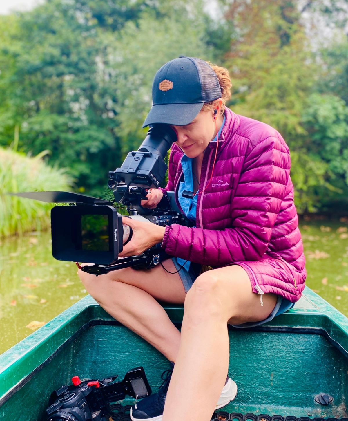 Olivia filming from a small boat