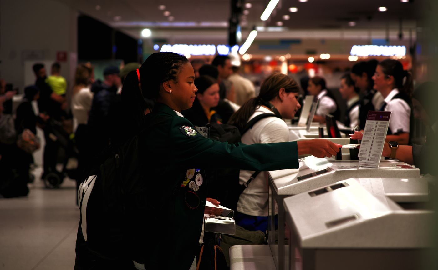 A traveller at an airport check-in counter
